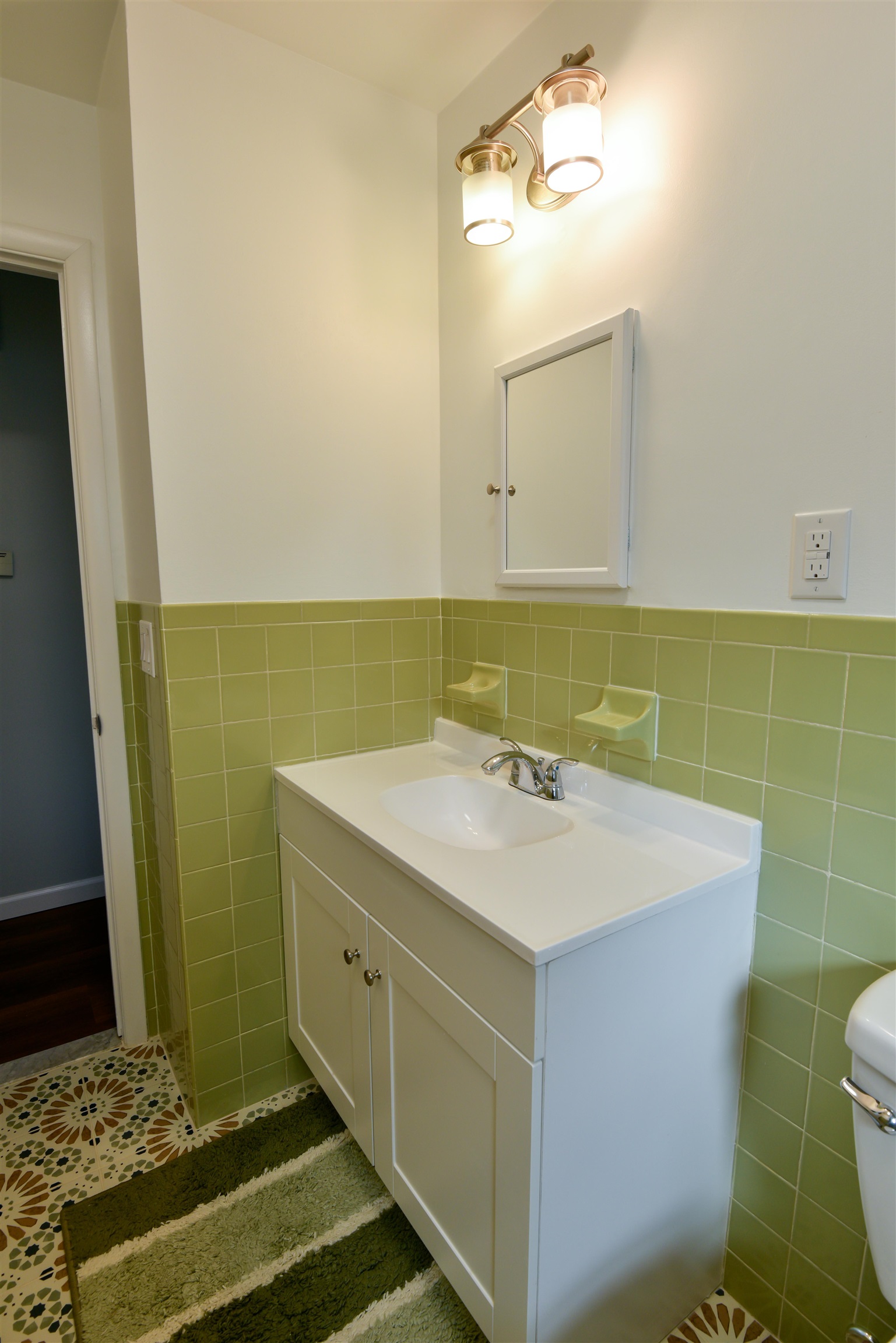 45 East 51st Street Bayonne, NJ 07002 - Photo 14 of 26 a bathroom with a sink and a mirror