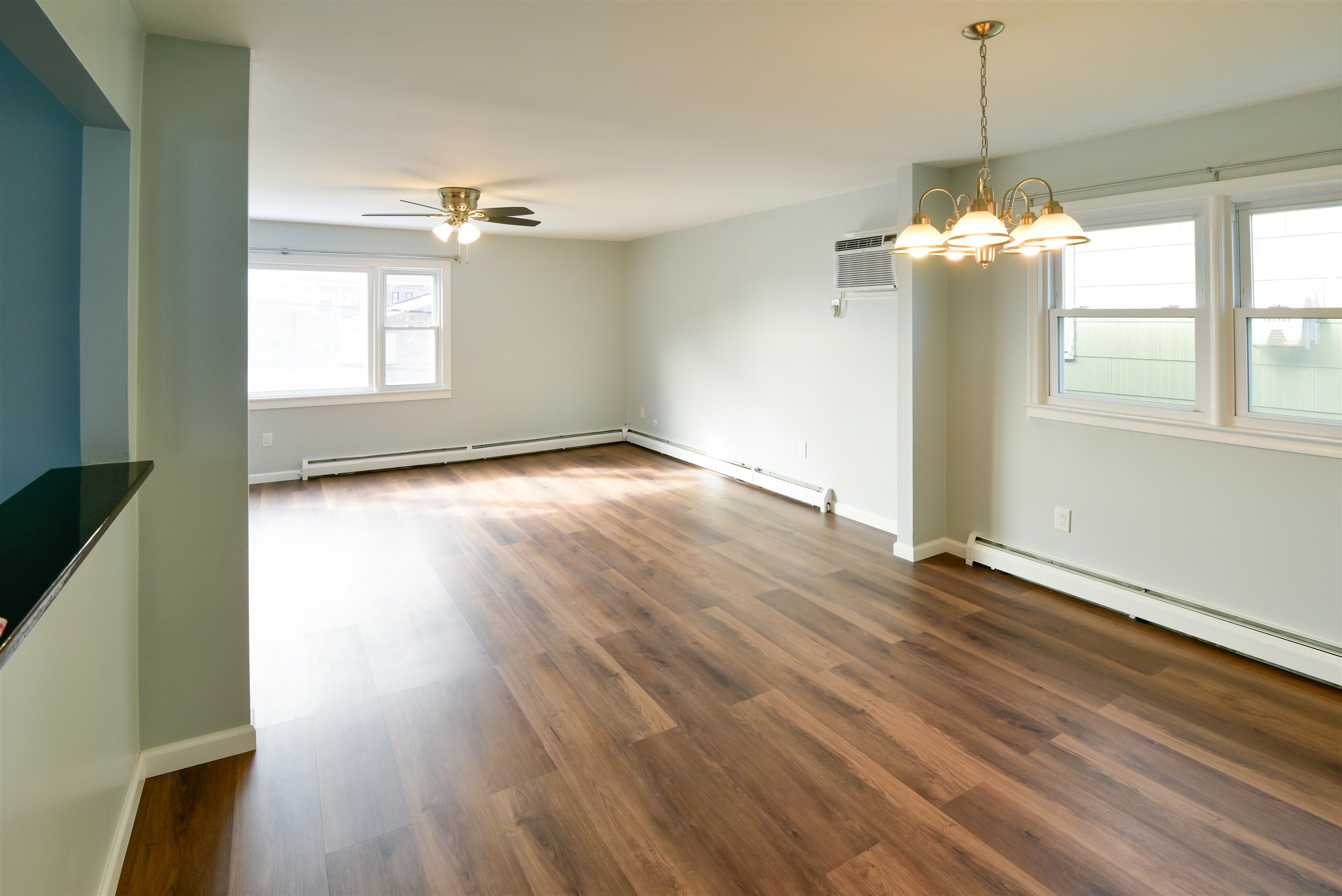45 East 51st Street Bayonne, NJ 07002 - Photo 9 of 26 a view of an empty room with a window and wooden floor