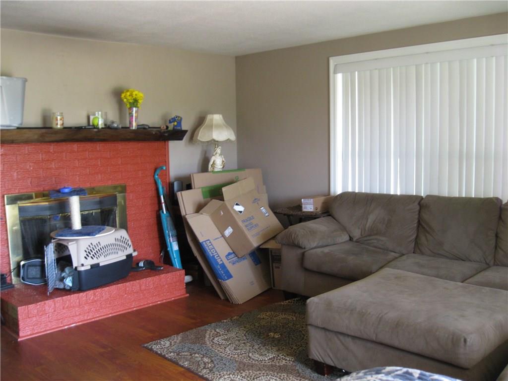 4060 Old Mercer Road New Castle, PA 16105 - Photo 11 of 20 Living room w/ log burning fireplace