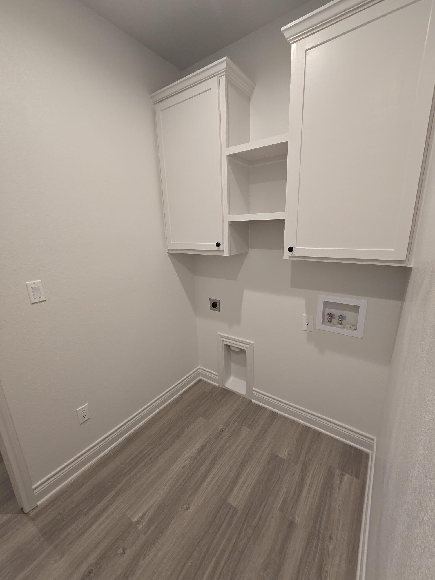 7814 53rd Street Lubbock, TX 79407 - Photo 22 of 24 wooden floor in an empty room