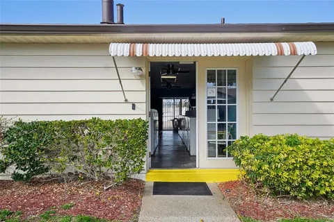 a view of a livingroom with furniture and window
