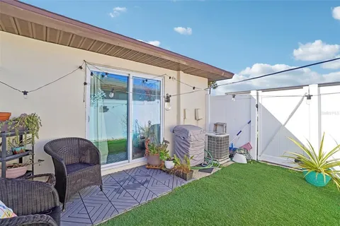 a house view with a seating space and garden