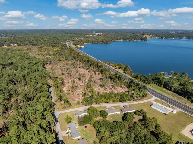 a view of a lake with a yard