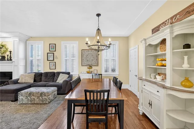 a living room with furniture a window and a chandelier