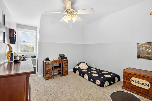 a bedroom with furniture and a chandelier