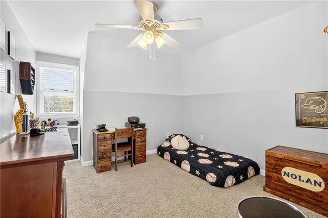 a bedroom with furniture and a chandelier