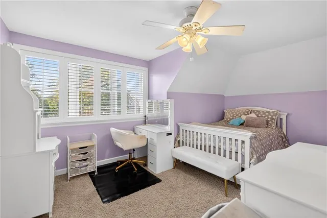 a bedroom with furniture and a window