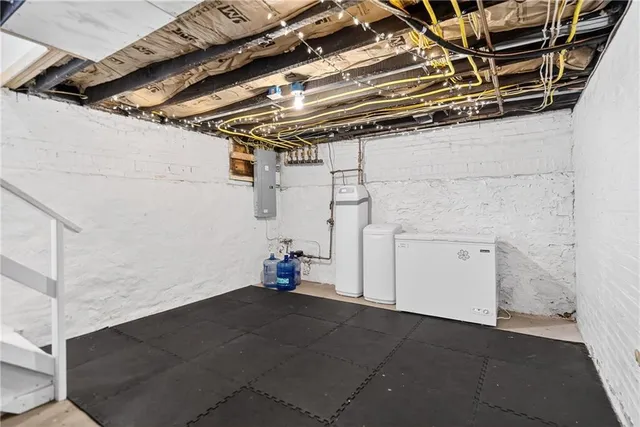 a kitchen that has a sink a stove and a table