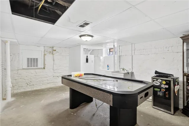 an empty room with furniture and a window