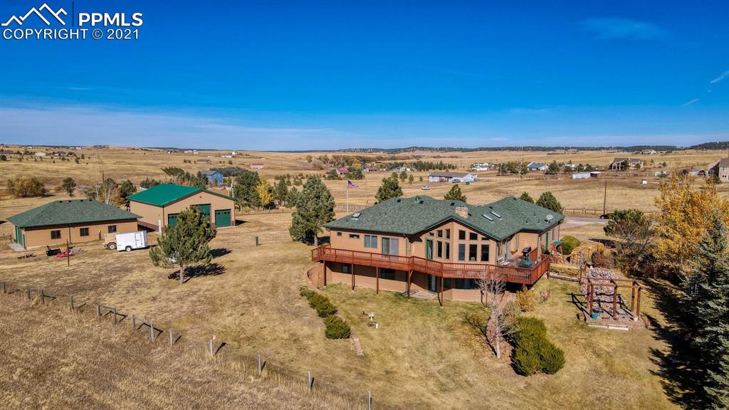 13770 Woodlake Road Elbert, CO 80106 - Photo 2 of 43 an outdoor view of house with yard