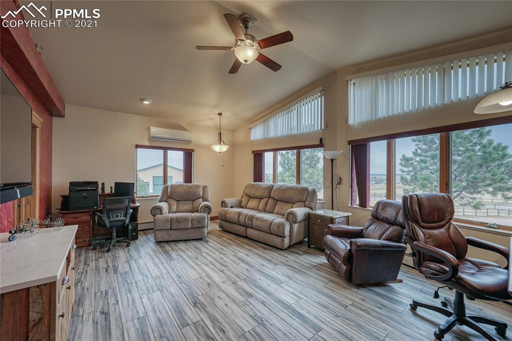 13770 Woodlake Road Elbert, CO 80106 - Photo 19 of 43 a living room with furniture and a large window