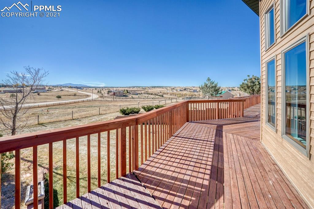 13770 Woodlake Road Elbert, CO 80106 - Photo 22 of 43 a view of balcony with wooden floor