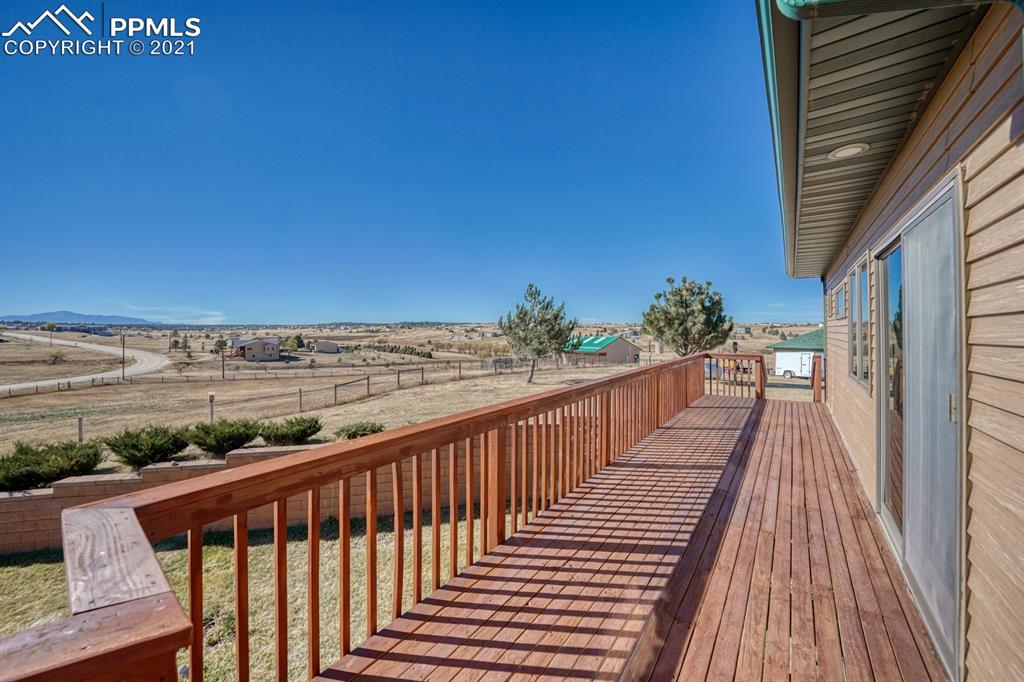 13770 Woodlake Road Elbert, CO 80106 - Photo 23 of 43 a view of a balcony with wooden floor