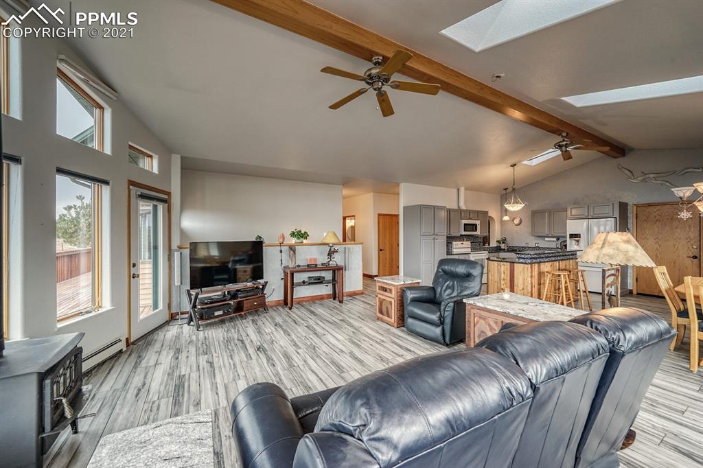 13770 Woodlake Road Elbert, CO 80106 - Photo 27 of 43 a living room with furniture and a flat screen tv