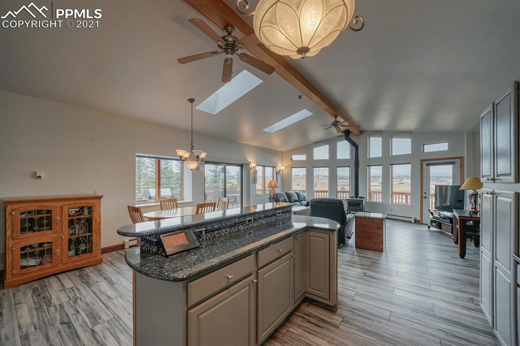 13770 Woodlake Road Elbert, CO 80106 - Photo 31 of 43 a kitchen with lots of counter top space and wooden floor