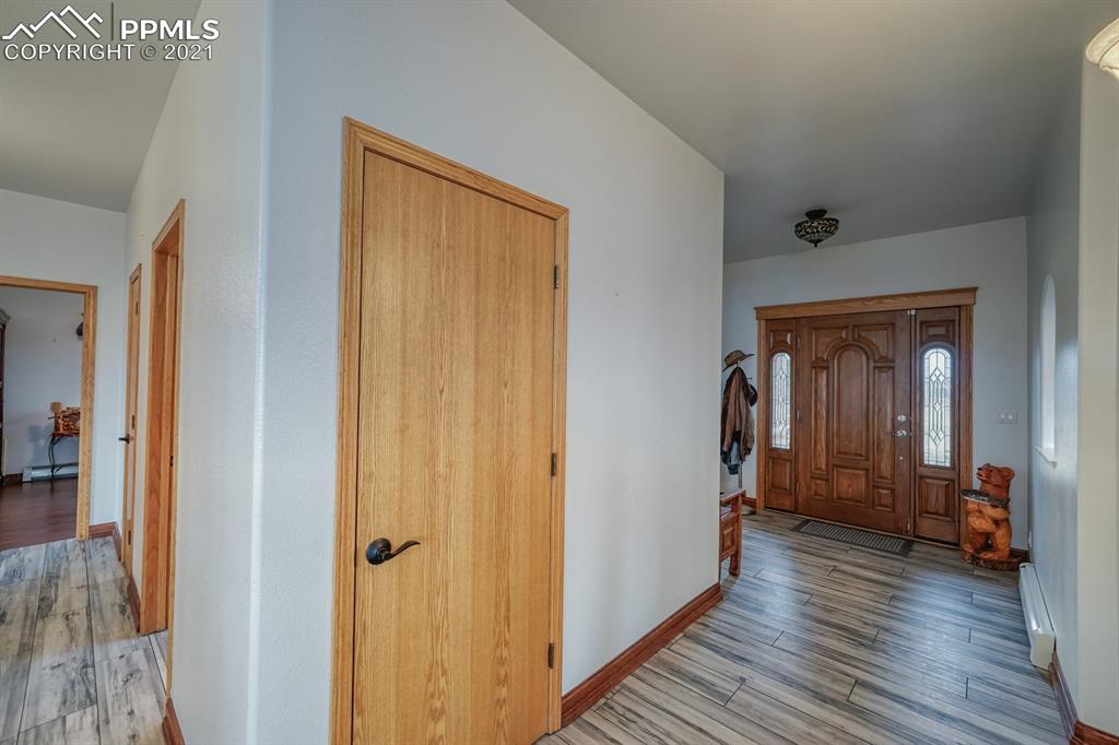 13770 Woodlake Road Elbert, CO 80106 - Photo 32 of 43 a view of hallway with wooden floor