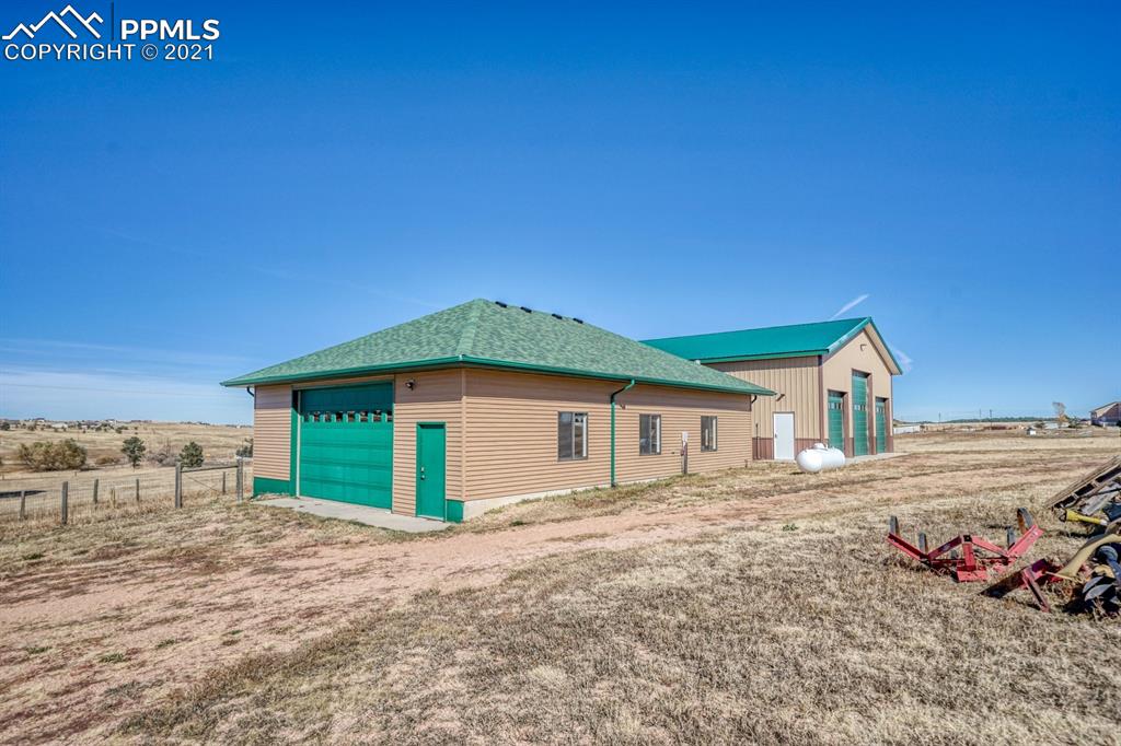 13770 Woodlake Road Elbert, CO 80106 - Photo 37 of 43 a view of a house with a yard