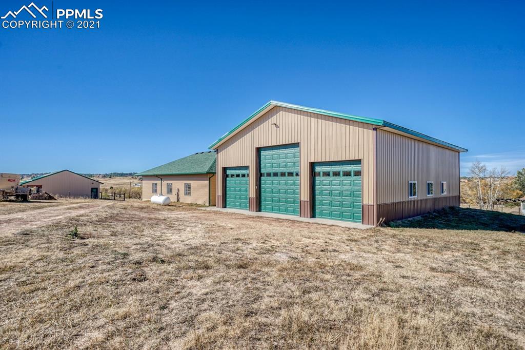 13770 Woodlake Road Elbert, CO 80106 - Photo 39 of 43 a front view of a house with a yard