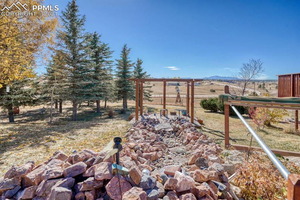 13770 Woodlake Road Elbert, CO 80106 - Photo 40 of 43 a view of a backyard with sitting area