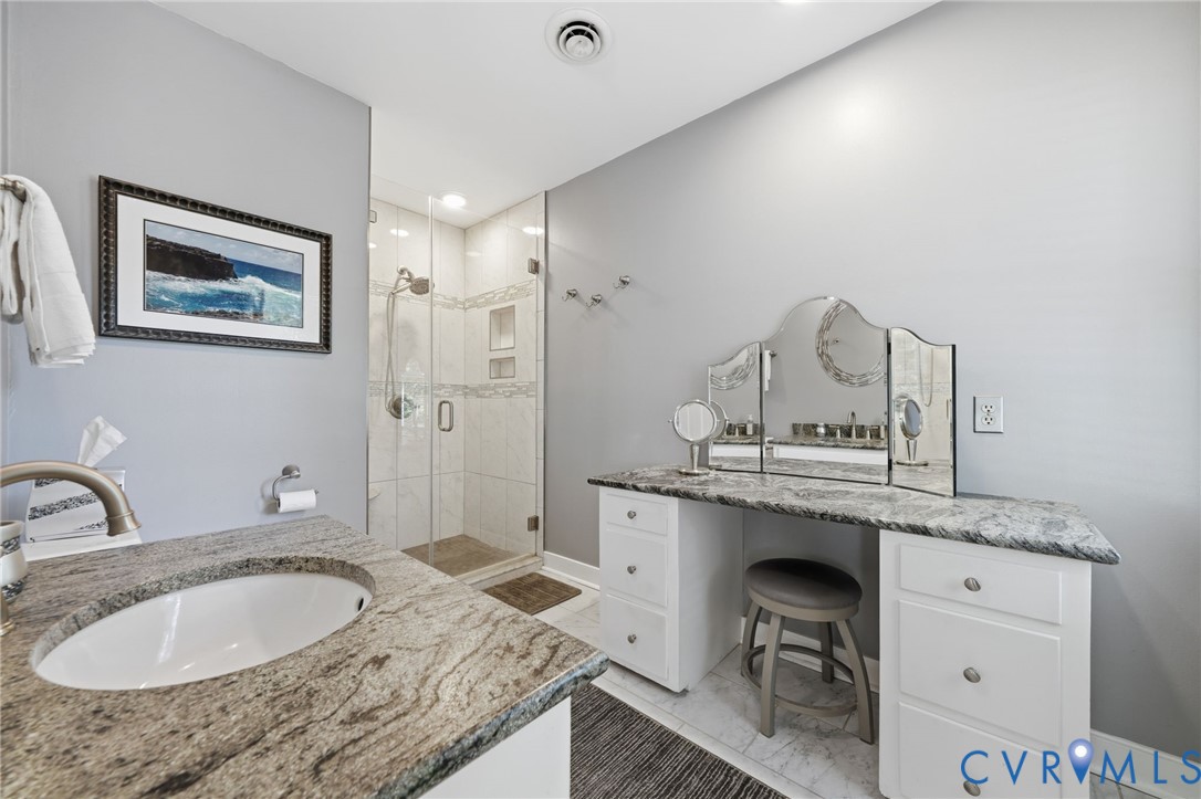 2101 Castlebridge Road Midlothian, VA 23113 - Photo 23 of 37 a bathroom with a granite countertop sink and a mirror