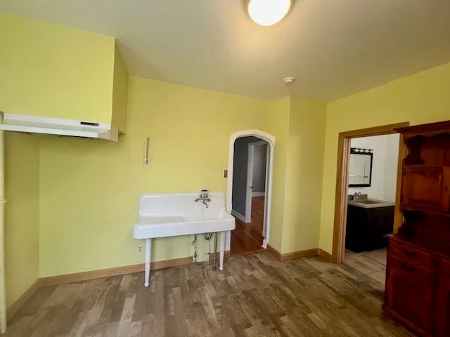 a room that has a bed and a table in it