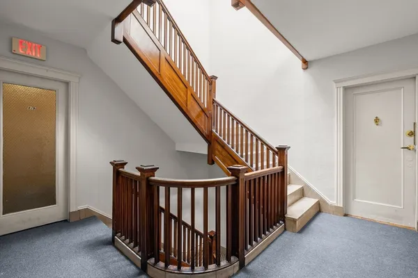 a view of staircase with railing and stairs