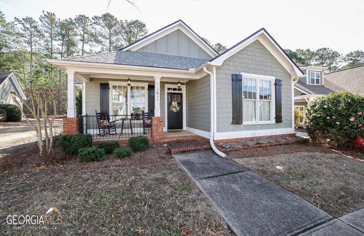 1611 Carriage Ridge Drive Greensboro, GA 30642 - Photo 1 of 1 a front view of a house with garden