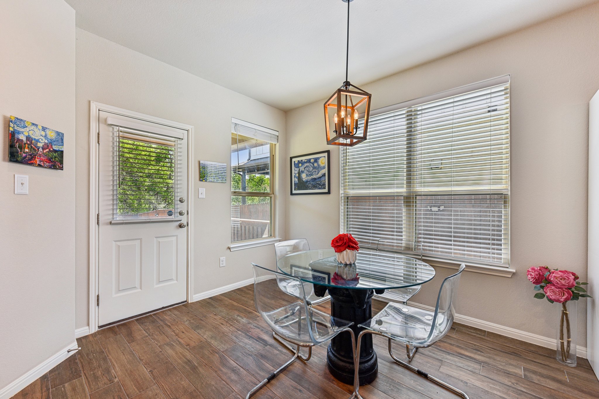 908 Goldilocks Lane Manchaca, TX 78652 - Photo 12 of 34 Bright and wrapped in windows, it's an easy spot for morning coffee.