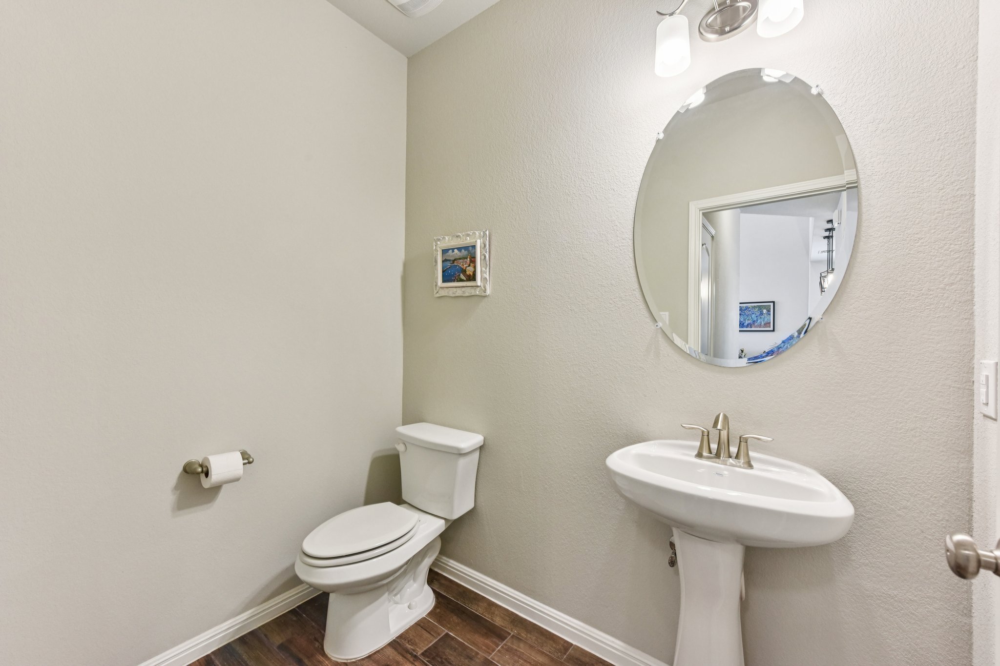 908 Goldilocks Lane Manchaca, TX 78652 - Photo 13 of 34 There's a downstairs powder room for guest access.