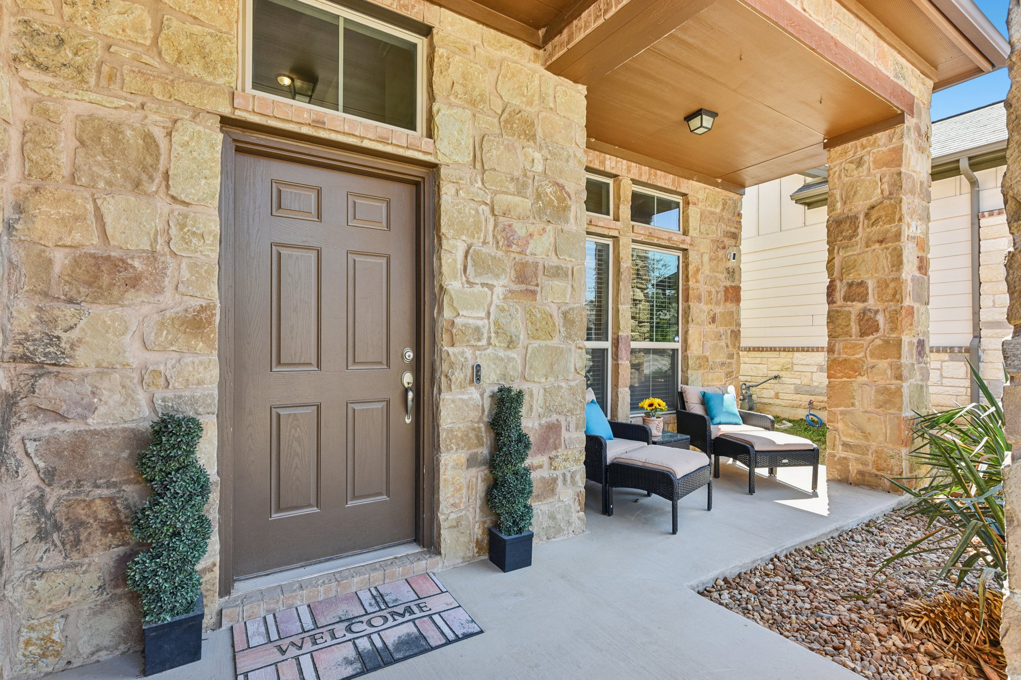 908 Goldilocks Lane Manchaca, TX 78652 - Photo 6 of 34 The loveley front porch not only adds to the curb appeal but it's a great spot for enjoying the sunset.
