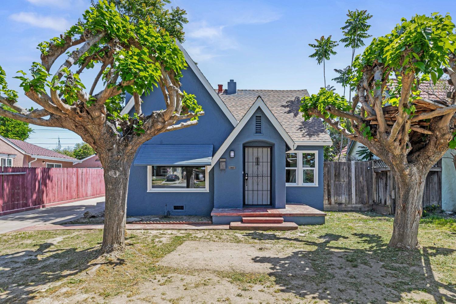 a front view of a house with garden