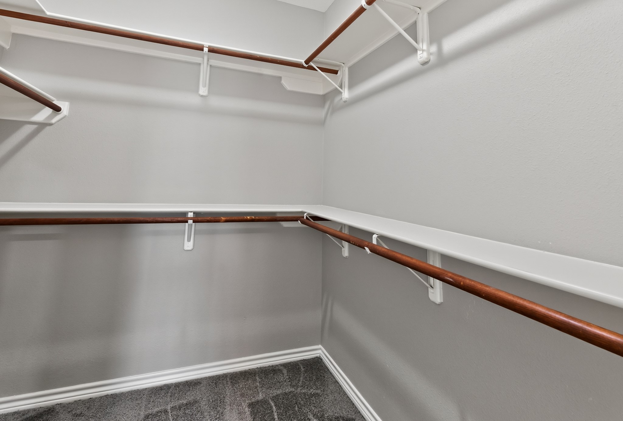 6 Regency Point Montgomery, TX 77356 - Photo 33 of 43 Spacious walk-in closet featuring ample hanging rods and shelving, perfect for organized storage.