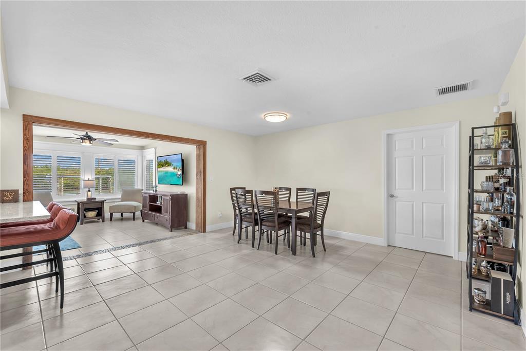 911 Silver Palm Way Apollo Beach, FL 33572 - Photo 12 of 35 a view of a dining room with furniture and window