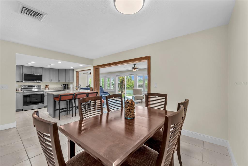 911 Silver Palm Way Apollo Beach, FL 33572 - Photo 13 of 35 a view of a dining room with furniture