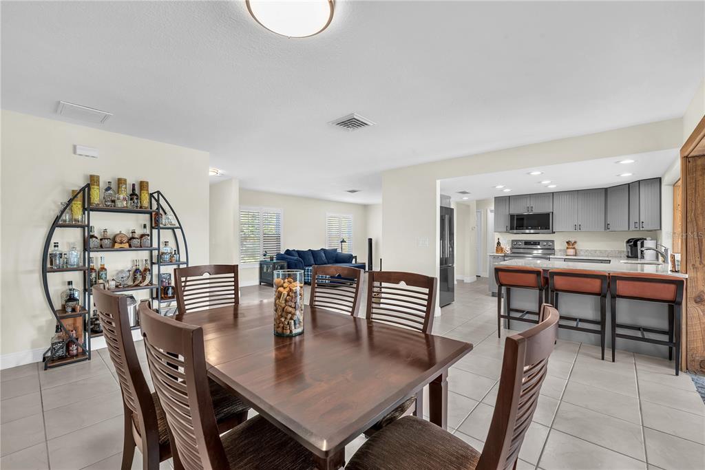911 Silver Palm Way Apollo Beach, FL 33572 - Photo 14 of 35 a view of a dining room with furniture