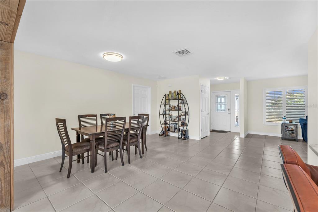 911 Silver Palm Way Apollo Beach, FL 33572 - Photo 15 of 35 a view of a livingroom with furniture and chandelier