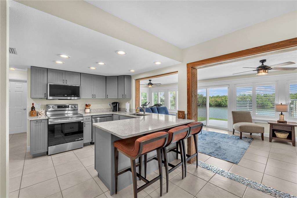 911 Silver Palm Way Apollo Beach, FL 33572 - Photo 18 of 35 a large kitchen with a table and chairs