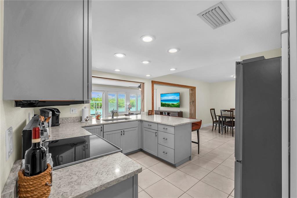 911 Silver Palm Way Apollo Beach, FL 33572 - Photo 19 of 35 a kitchen with sink cabinets and microwave