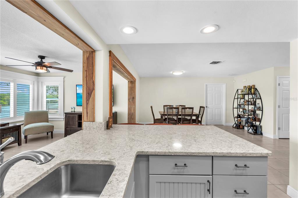 911 Silver Palm Way Apollo Beach, FL 33572 - Photo 20 of 35 a kitchen with stainless steel appliances granite countertop a sink stove and cabinets