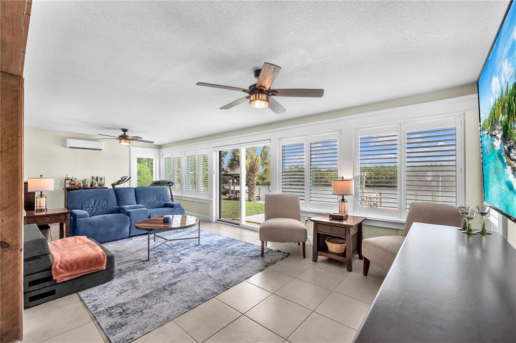 911 Silver Palm Way Apollo Beach, FL 33572 - Photo 22 of 35 a living room with furniture and large windows