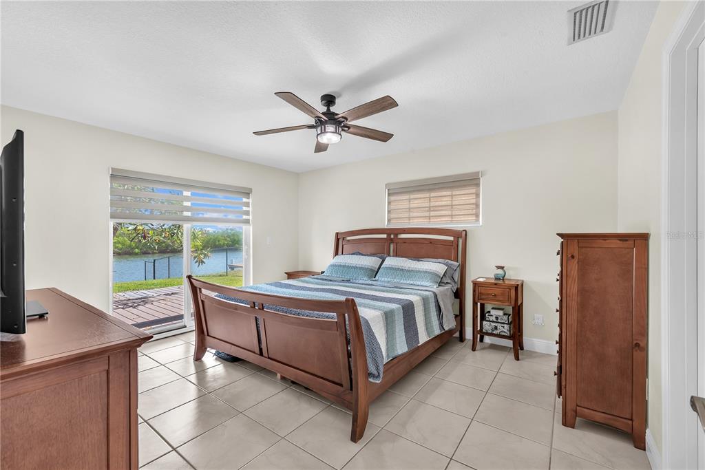 911 Silver Palm Way Apollo Beach, FL 33572 - Photo 26 of 35 a bed room with a bed and a large window