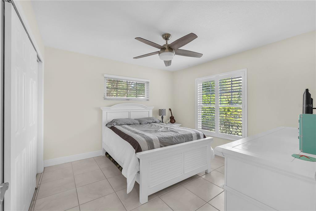 911 Silver Palm Way Apollo Beach, FL 33572 - Photo 28 of 35 a bedroom with a bed and window