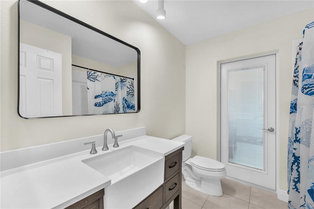 911 Silver Palm Way Apollo Beach, FL 33572 - Photo 29 of 35 a white toilet sitting next to a bathroom sink