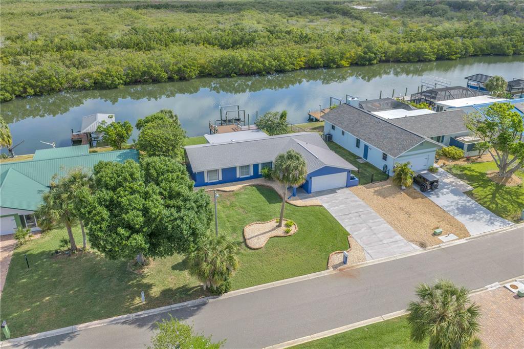 911 Silver Palm Way Apollo Beach, FL 33572 - Photo 34 of 35 an aerial view of a house with garden space and lake view