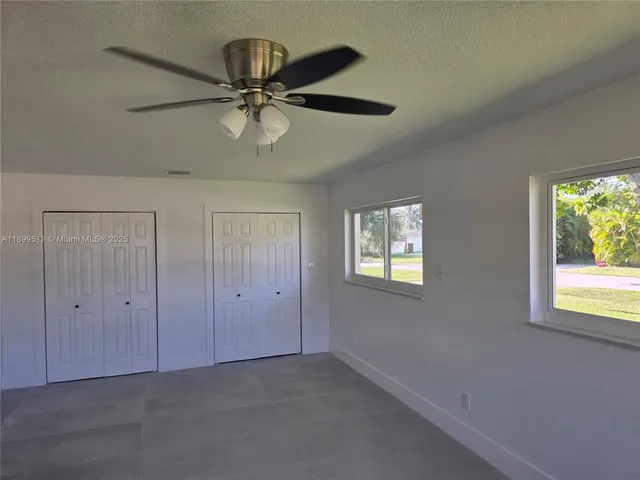 a bathroom with a double vanity sink and mirror