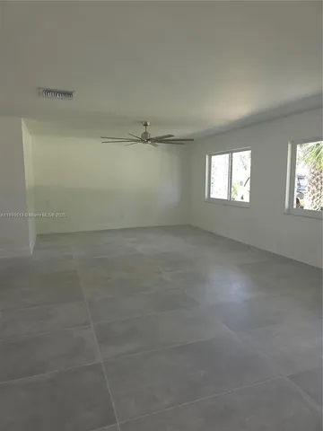 a white toilet sitting next to a white sink