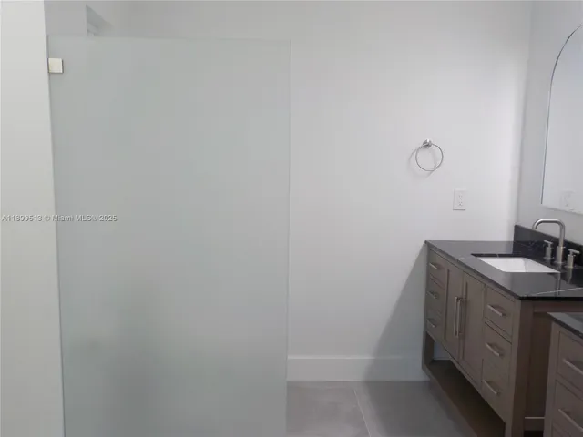 a kitchen with stainless steel appliances granite countertop a sink and a stove