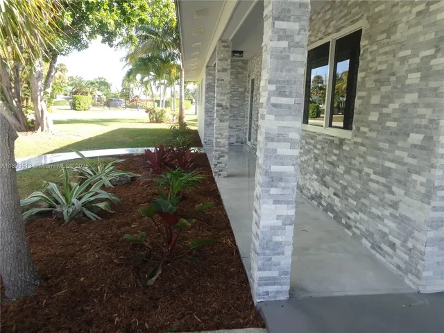 a view of a yard front of house