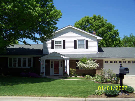 3518 North View Road Rockford, IL 61114 - Photo 1 of 10 a front view of a house with a garden