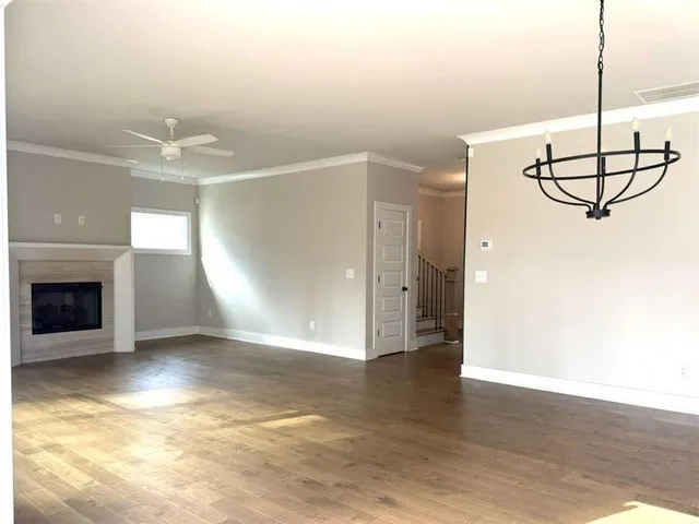 a view of a livingroom with a fireplace and window